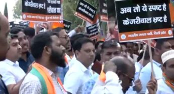 BJP Protests Outside AAP Office, Demands Arvind Kejriwals Resignation As ED Raids Sanjay Singhs Residence